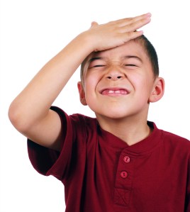 Kid slaps himself on head, oh-no, isolated on white